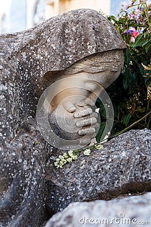 Praying stone virgin Stock Photo