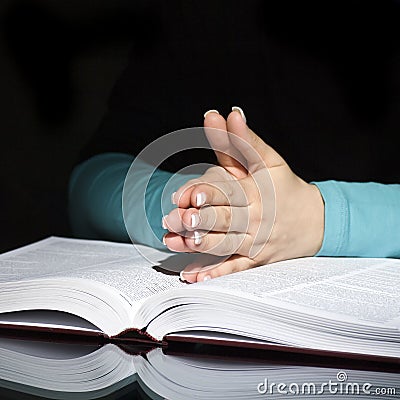 Praying woman and bible Stock Photo