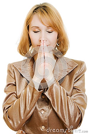 Praying woman in business suit with gold Stock Photo