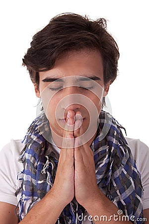 Praying young man Stock Photo