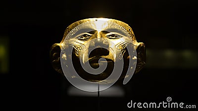 Pre-Columbian gold mask displayed at the Gold Museum, Bogota, Colombia Editorial Stock Photo