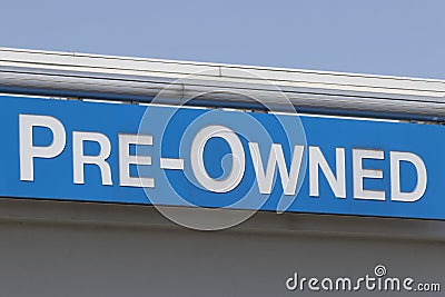 Pre-Owned Cars sign at a used car dealership. As supplies of new cars dwindle, used cars become more popular Stock Photo