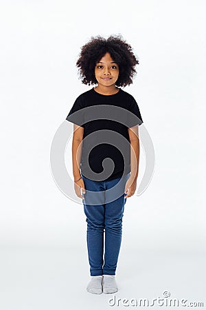 Pre-teen African American kid in casual style standing still Stock Photo