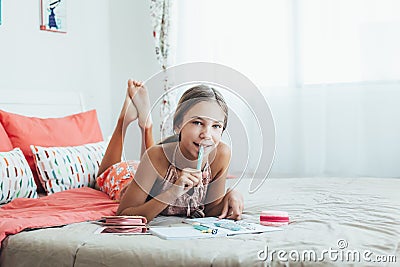 Pre teen girl doing school homework Stock Photo