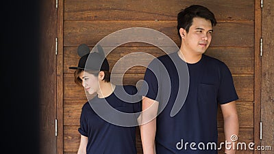 Pre wedding shooting for lover : Stand in front of wooden wall Stock Photo