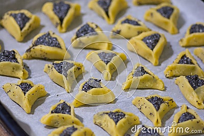 Prebaked `Haman pockets` also known as Hamantashen, an Ashkenazi Jewish triangular filled-pocket cookies Stock Photo