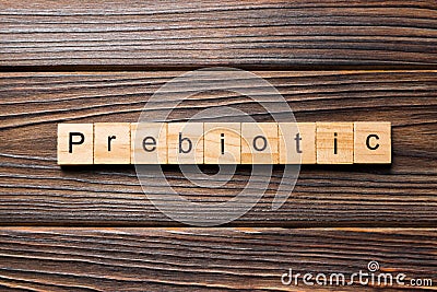 Prebiotic word written on wood block. prebiotic text on table, concept Stock Photo