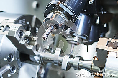 Precision CNC metal machining by mill, drill and cutter Stock Photo