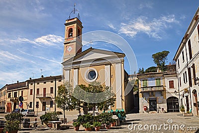 Predappio Alta, Forli Cesena, Emilia Romagna, Italy: the main square Piazza Cavour with the church and the Post office Stock Photo