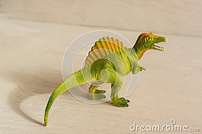 Predatory spinosaurus with open mouth, plastic dinosaur figures of extinct ancient creatures and favorite toys of kids Stock Photo