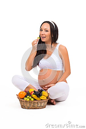 Pregnancy, health and beauty. Proper nutrition. Vitamins and fruit for pregnant women Stock Photo