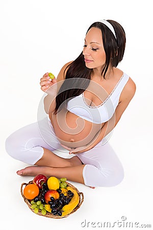 Pregnancy, health and beauty. Proper nutrition. Vitamins and fruit for pregnant women Stock Photo