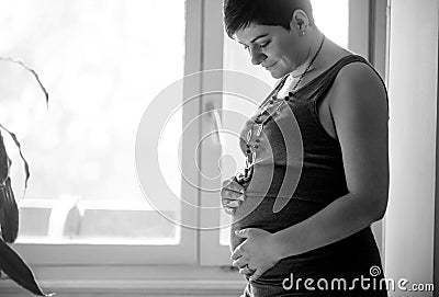 Pregnancy, love, people and expectation concept - happy pregnant Stock Photo