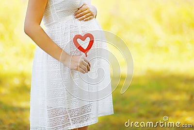 Pregnancy, maternity and new family concept - pregnant woman Stock Photo