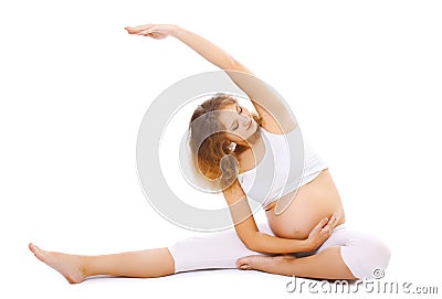 Pregnancy, motherhood, fitness and yoga concept - pregnant woman Stock Photo