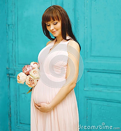 Pregnancy, motherhood and happy future mother concept - woman Stock Photo