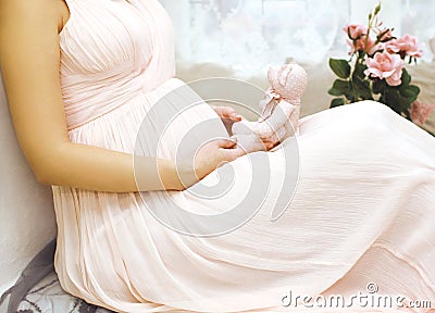 Pregnancy, motherhood and happy future mother concept - woman Stock Photo