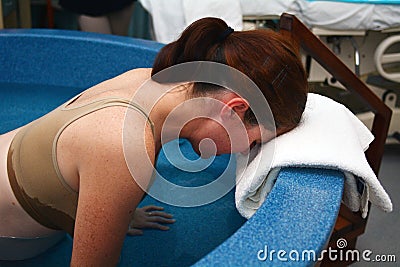 Pregnancy - pregnant woman natural water birth Stock Photo