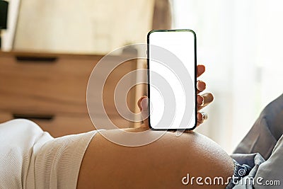 Pregnancy screen mockup. Mobile pregnancy online maternity application mock up. Pregnant mother using phone. Concept of Stock Photo