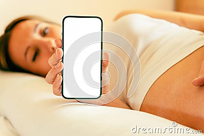 Pregnancy screen mockup. Mobile pregnancy online maternity application mock up. Pregnant mother using phone. Concept of Stock Photo