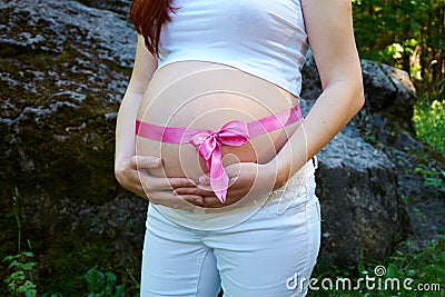 Pregnancy women and rose ribbon Stock Photo