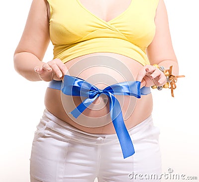 Pregnant belly with blue stripe and bowknot Stock Photo