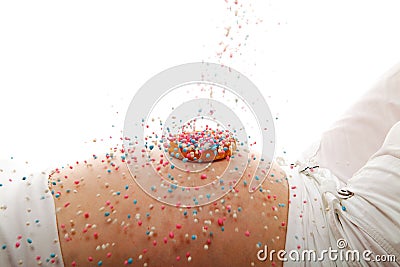 Pregnant belly with rusk and falling colorful mice Stock Photo