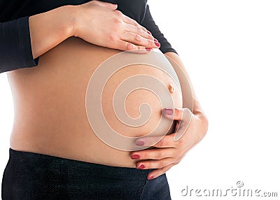 Pregnant belly. Third trimester. Isolated on white Stock Photo