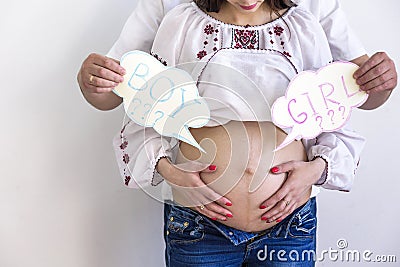 Pregnant couple choosing gender of the baby, the child`s name. The problem of choice for a husband and wife Stock Photo