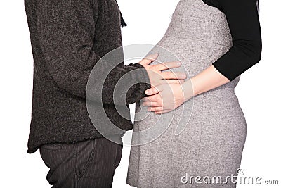 Pregnant couple in woolen dresses Stock Photo