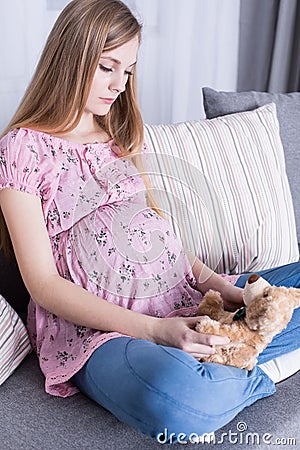 Pregnant girl waiting in anticipation for childbirth Stock Photo