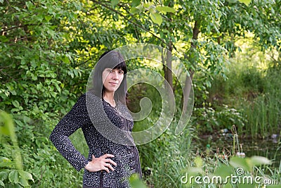 The pregnant girl on walk Stock Photo