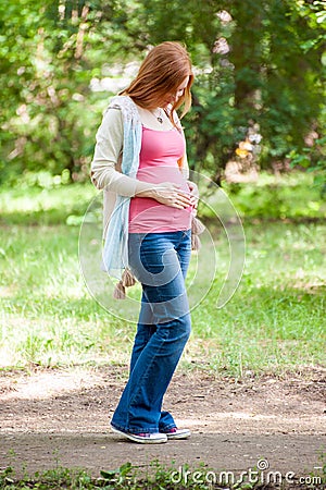 Pregnant redhead woman Stock Photo