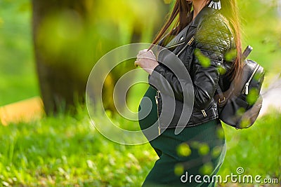 Pregnant schoolgirl. Attractive pregnant woman in dress schoolgirl posing on the street. Long-haired pregnant woman walking down Stock Photo