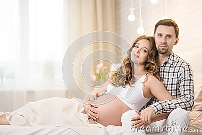 Pregnant wife and husband Stock Photo