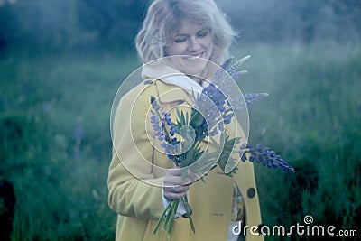 Pregnant woman with blue flowers Stock Photo