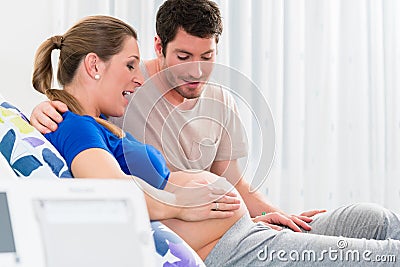 Pregnant woman in delivery room with her man Stock Photo