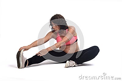 Pregnant woman doing floor exercises on white background Stock Photo