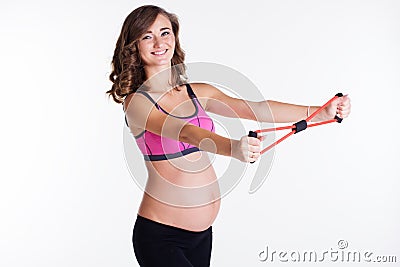 Pregnant woman doing pilates with rubber band Stock Photo