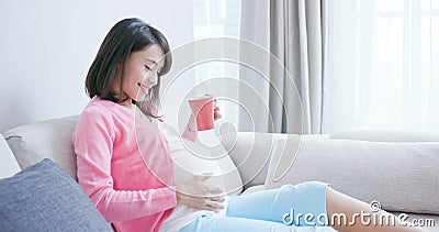 Pregnant woman drink tea Stock Photo