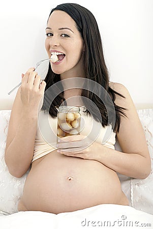 pregnant-woman-eating-pickled-onions-19627656.jpg