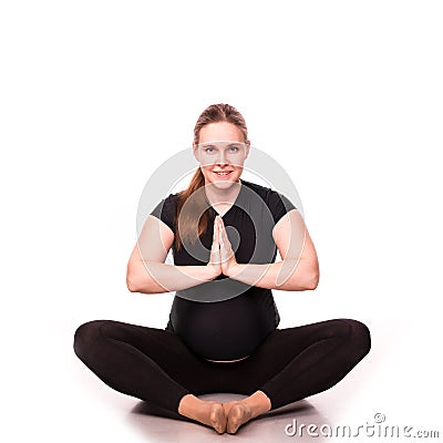 Pregnant woman exercising isolated on white Stock Photo