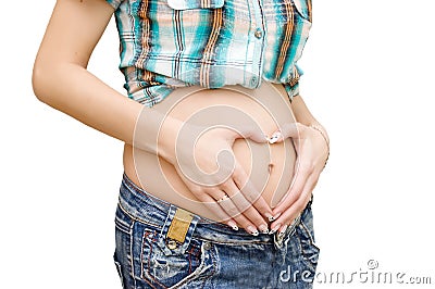 Pregnant woman fingers forming heart shape Stock Photo