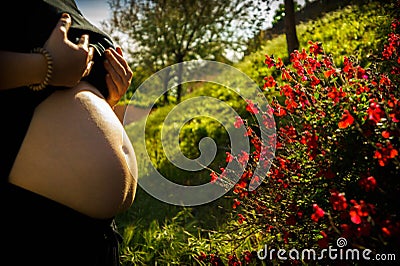 Pregnant woman with floral pattern Stock Photo