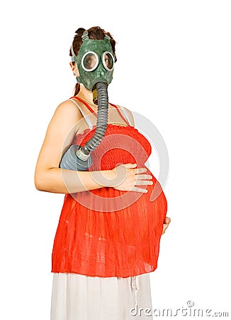 Pregnant woman in gas-mask holding belly Stock Photo