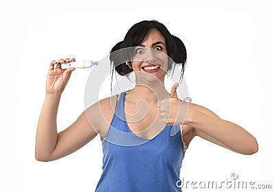 Pregnant woman happy and relieved checking blue negative result on pregnancy test Stock Photo