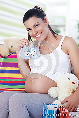 Pregnant woman has bought things for your baby Stock Photo