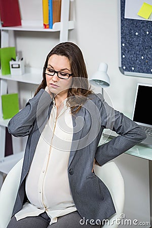 Pregnant woman having a back pain Stock Photo