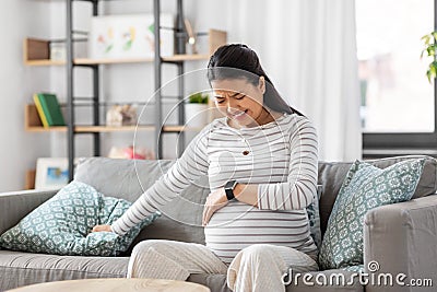 pregnant woman having labor contractions at home Stock Photo