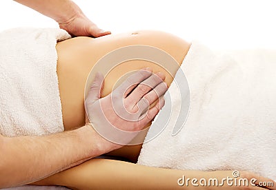 Pregnant woman having a relaxing massage Stock Photo